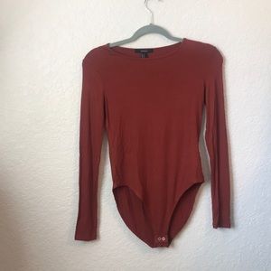 Rust colored body suit